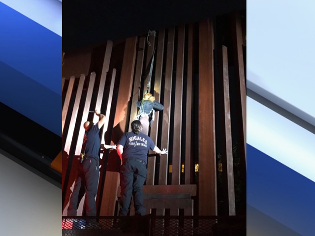 Border Patrol agents find woman dangling from border fence