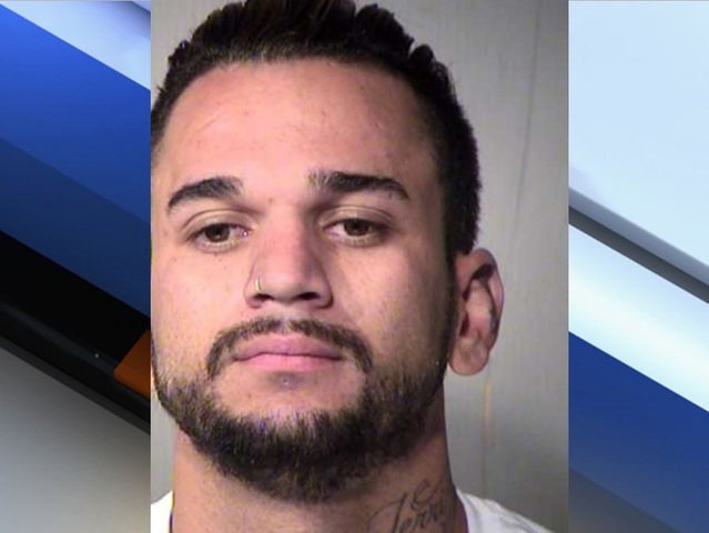 PD: Man with gun stops brass knuckle attack in Peoria